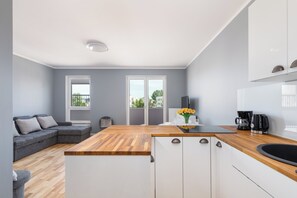 Studio, Balcony | Private kitchen | Microwave, dishwasher, coffee/tea maker, cookware/dishes/utensils - Studio Łużycka With Parking by Renters (Swinoujscie)