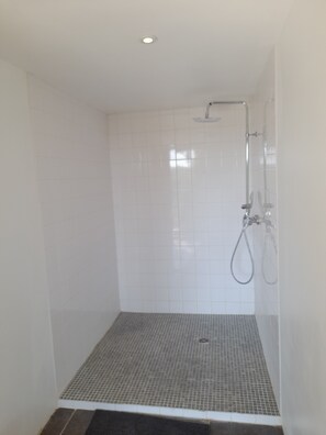 A small, enclosed shower area with a tiled floor and a showerhead. - Pretty house near nature and Verdon and sea (Montferrat)