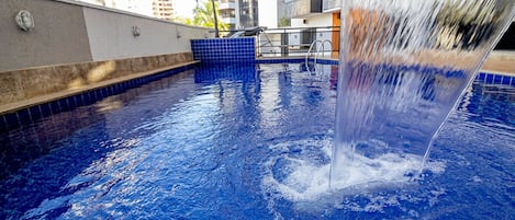 Outdoor pool, open 6:00 AM to 9:30 PM, pool loungers