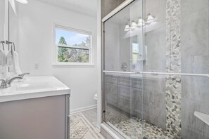 Shower, hair dryer, towels, soap