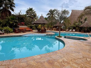 Outdoor pool, open 8:00 AM to 9:00 PM, pool umbrellas
