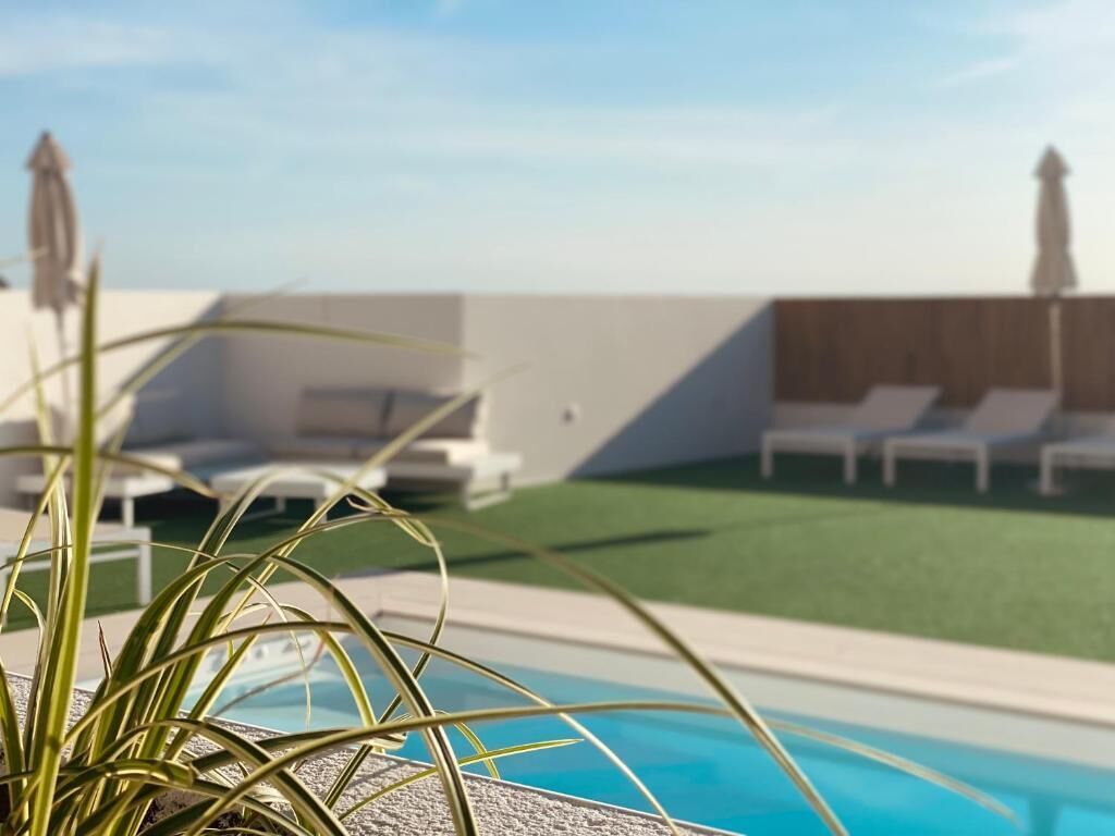 Seasonal outdoor pool, pool umbrellas, pool loungers