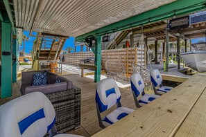 Outdoor dining - Inviting waterfront home with hot tub, kayaks, game room, W/D, & dog-friendly (Jamaica Beach)