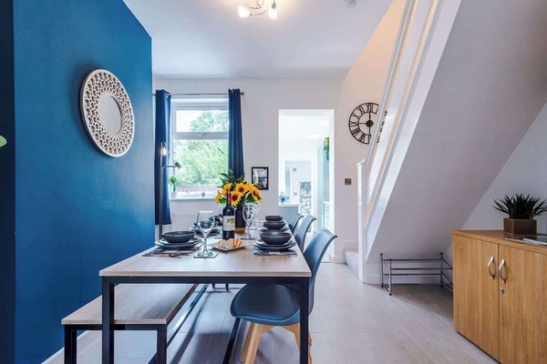 The dining room benefits from a large dining table that can sit 6 people.