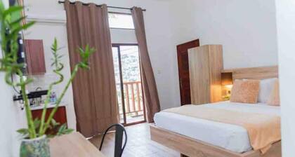 The Treehouse Studio apartments with a large rooftop terrace.