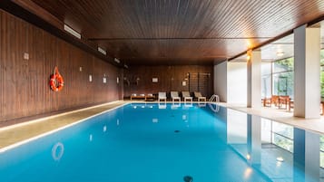 Indoor pool, open 8:30 AM to 8:00 PM, pool umbrellas, pool loungers