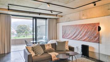 Apartment (1 Bedroom) | Living area | Flat-screen TV