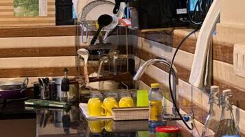 Fridge, stovetop, electric kettle, cookware/dishes/utensils