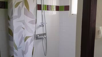 Shower, hair dryer, towels, toilet paper