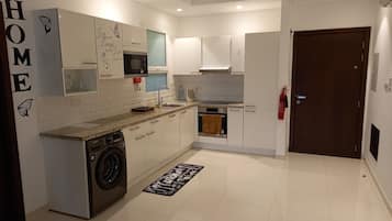 Apartment | Private kitchen | Fridge, microwave, oven, stovetop