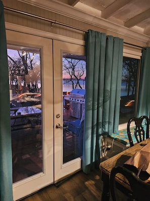 A room with a sliding glass door leading to an outdoor patio area.