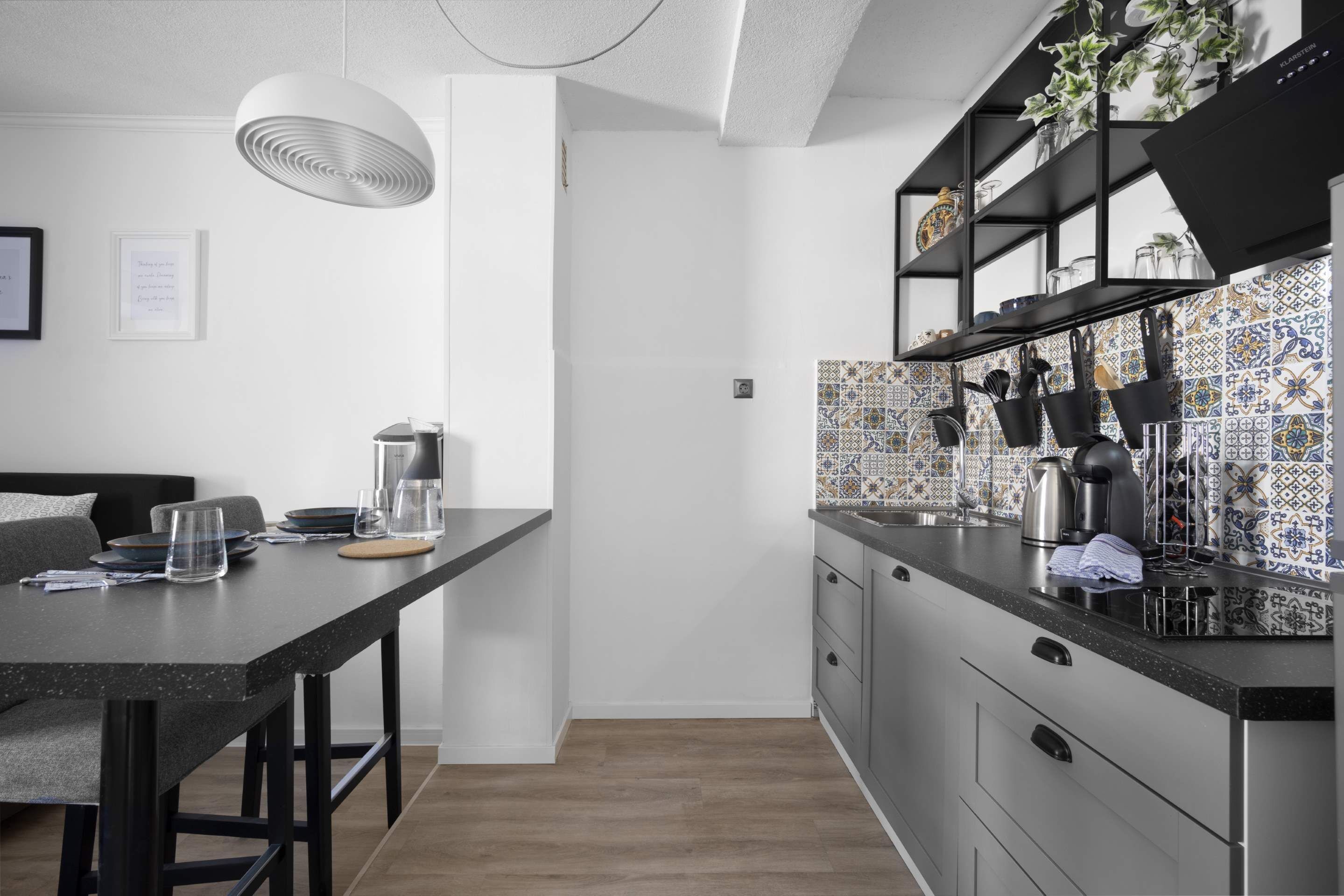 Fridge, stovetop, dishwasher, coffee/tea maker