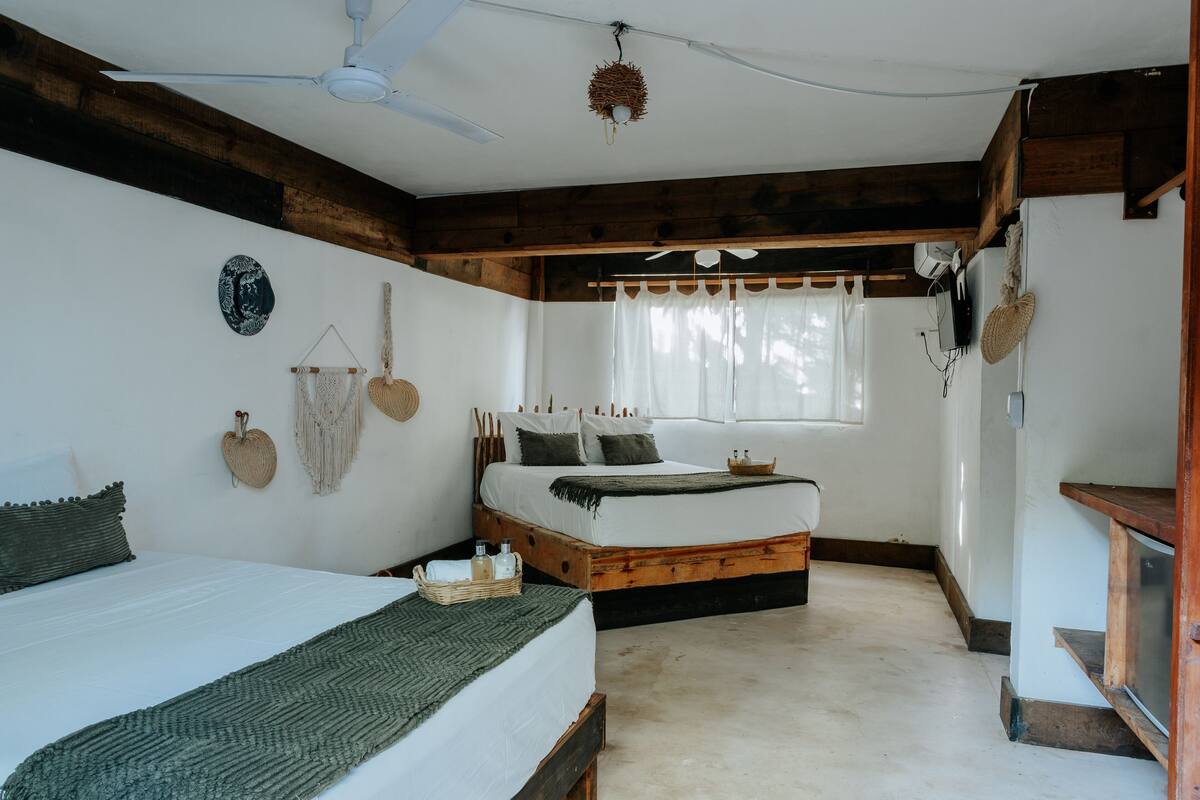 Deluxe Quadruple Room | Premium bedding, minibar, in-room safe, laptop workspace