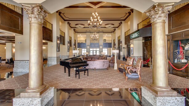 A grand lobby with a grand piano, ornate columns, a chandelier, and a spacious seating area. - Loretto Vacation Rental: 7 Mi to State Park! (Loretto)