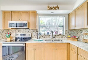 Fridge, microwave, stovetop, coffee/tea maker