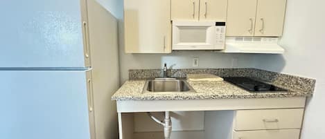 Mini-fridge, microwave, stovetop, coffee grinder