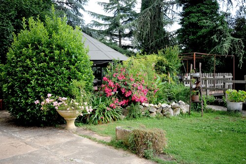 ANCIENT FARMHOUSE SURROUNDED BY GREENERY