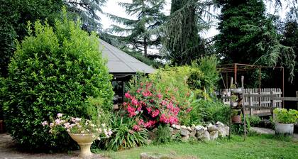 ANCIENT FARMHOUSE SURROUNDED BY GREENERY