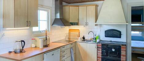 Fridge, stovetop, dishwasher, coffee/tea maker