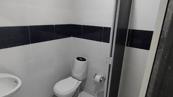 Shower, rainfall showerhead, hair dryer, towels