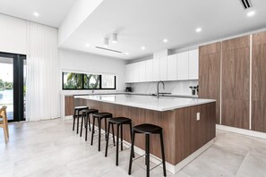 Fridge, microwave, oven, stovetop - Modern Waterfront Paradise with Heated Pool - Near the Beach & Aventura Mall! (Miami)