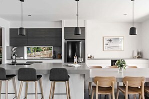 Coffee/tea maker, fridge, microwave, oven