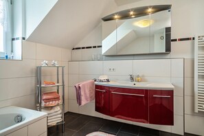 Bathtub, hair dryer, towels