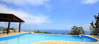 Villa Eichi: A welcoming apartment that is part of a villa in a quiet position, located on a hillside above the sea, with Free WI-FI.