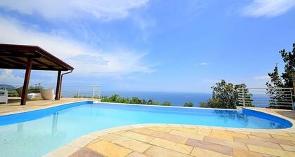 Villa Eichi: A welcoming apartment that is part of a villa in a quiet position, located on a hillside above the sea, with Free WI-FI.