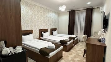Senior Triple Room | Desk, blackout drapes, iron/ironing board, free WiFi