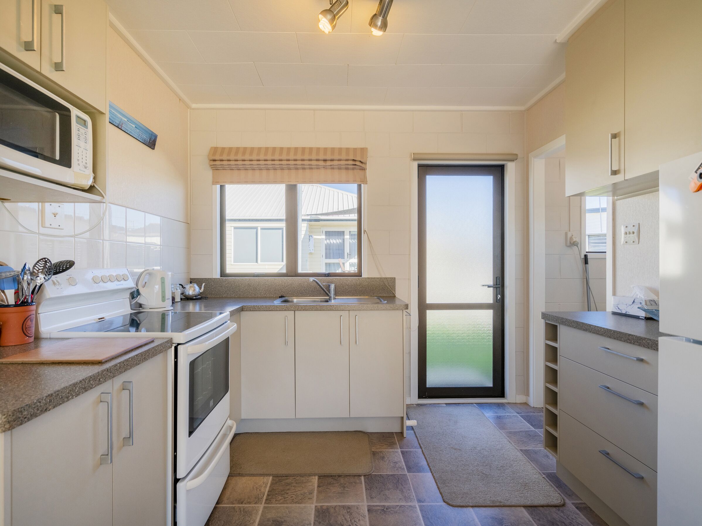 Fridge, microwave, toaster, cookware/dishes/utensils