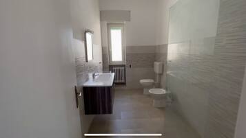 Hair dryer, bidet, soap, toilet paper