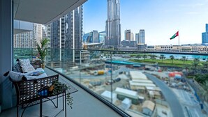 A balcony with a view of the Burj Khalifa and a flag. - Vogue, Downtown Opera Grand near Burj Khalifa & Dubai Mall, with Fountain view (Dubai)