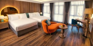Family Room, 1 Bedroom, Non Smoking, City View | Living area | 50-inch Smart TV with digital channels