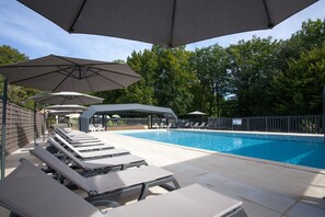 Relax by the pool surrounded by a tranquil atmosphere and comfortable lounge seating.