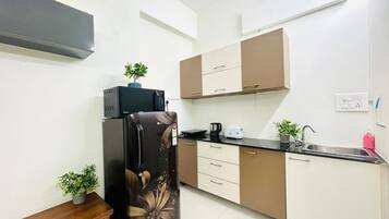 Fridge, microwave, electric kettle, toaster