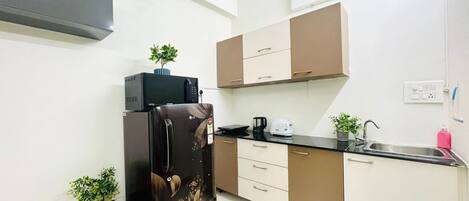 Fridge, microwave, electric kettle, toaster