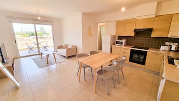 Comfort Apartment, 2 Bedrooms, Pool View | Living area | Flat-screen TV