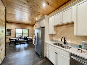 Private kitchen | Fridge, oven, coffee/tea maker, toaster - Bearly Behaving 2 Bedroom Cabin by RedAwning (Sevierville)