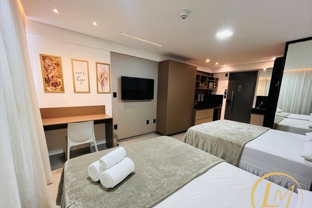 Premium bedding, pillow-top beds, desk, laptop workspace