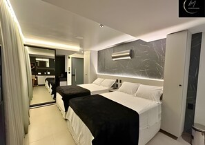 Premium bedding, pillow-top beds, desk, laptop workspace