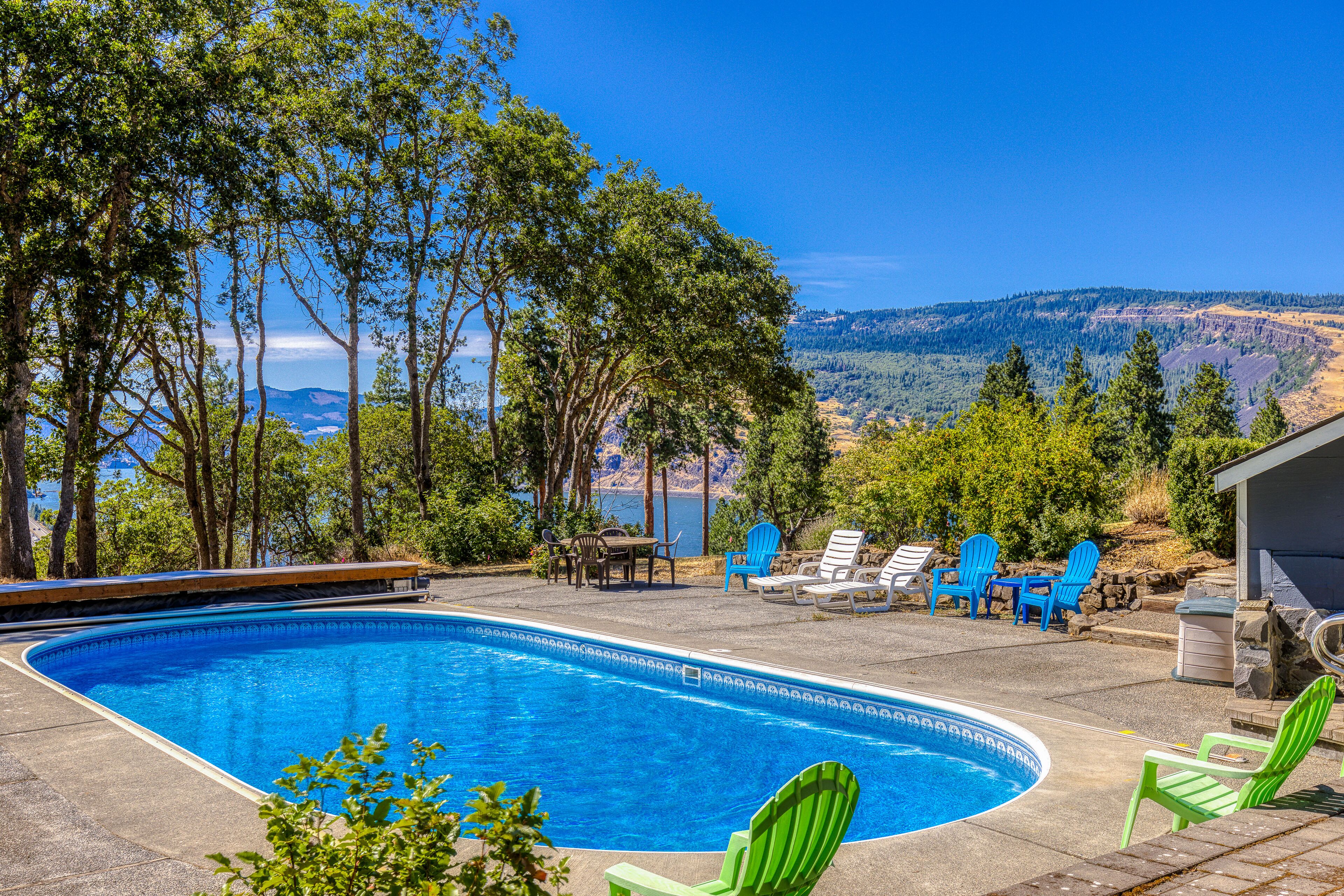 Dog-friendly home with amazing river views, shared pool, deck, grill, fireplace