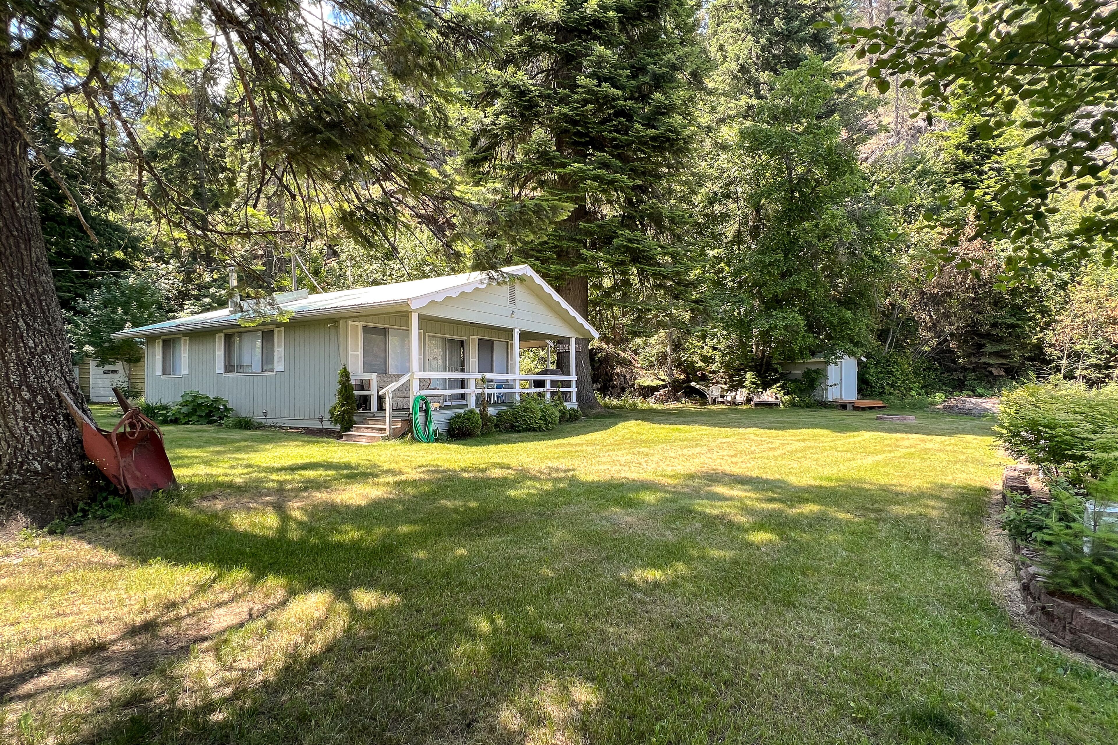 Lakefront home with private dock, large yard, wood stove, firepit, grill, W/D