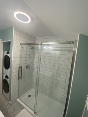 Shower, hair dryer, towels, toilet paper