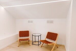 Cozy retreat with two chairs and a small table.