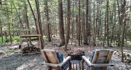 Escape from it all. Woods, birds, campfire and fresh air.