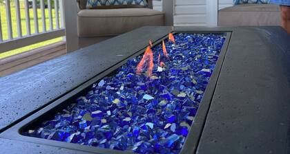 Fully custom modern four bedroom home on 13 acres with a stocked pond.