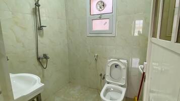 Comfort Apartment | Bathroom | Shower, towels, soap, shampoo