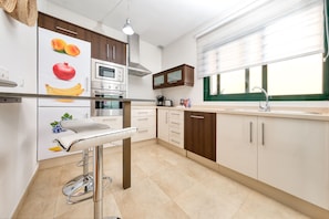 Coffee/tea maker, fridge, microwave, oven
