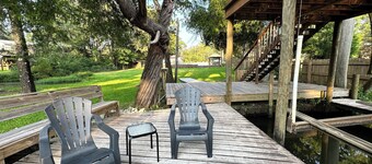 Cozy waterfront camp with dock and boat slip. Multiple outdoor spaces to enjoy!
